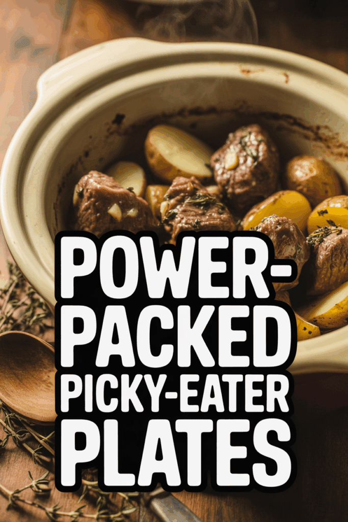A rustic slow cooker filled with tender beef chunks and halved baby potatoes, photographed on a wooden table with fresh herbs and a wooden spoon nearby. Large bold text overlay reads ‘Power-Packed Picky-Eater Plates.