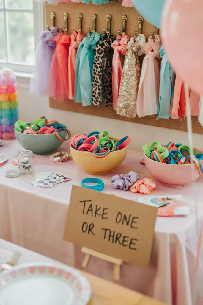 Slap bracelet and scrunchie favor bar with a rainbow of colors for a 90's kids party