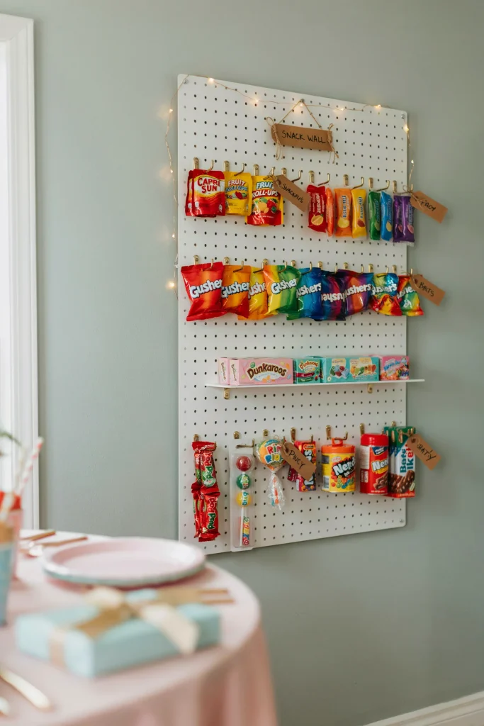 Throwback 90's snack wall with juice pouches and fruit snacks displayed on pegboard