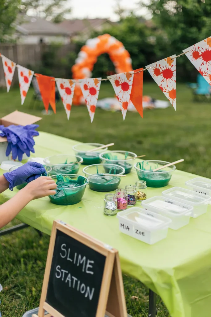 Nickelodeon-style green slime making station for a 90's kids birthday party