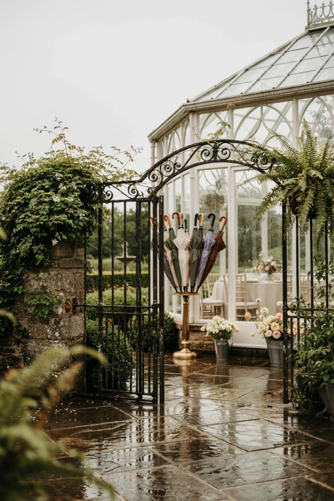 Decorative stand of pastel umbrellas near a spring garden party entrance