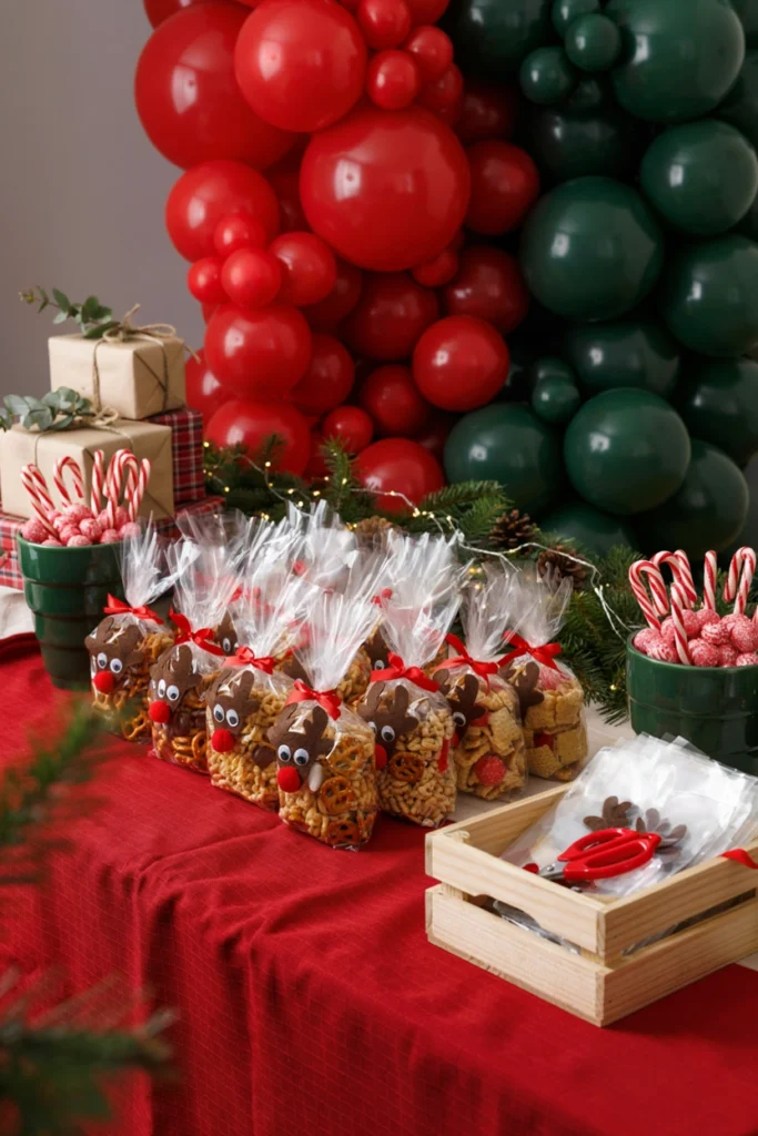 Small clear treat bags filled with pretzels, chocolate candies, and cereal, tied with brown ribbon and googly-eye reindeer stickers