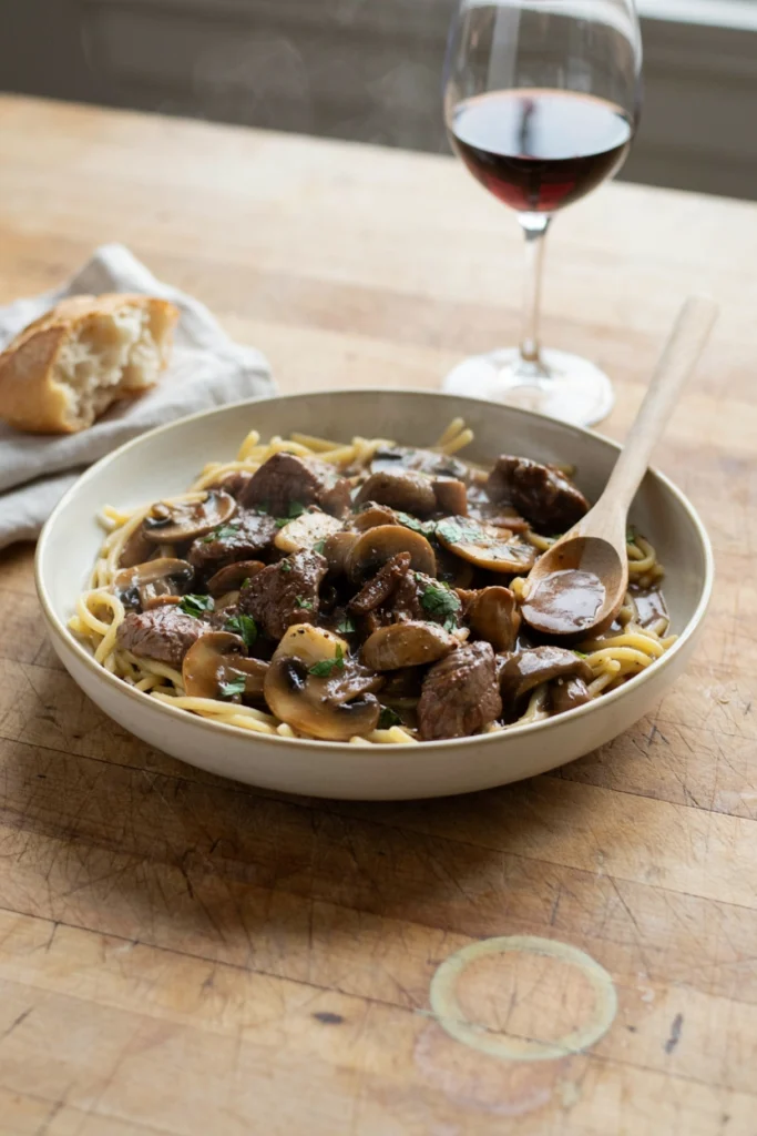 Creamy beef stroganoff with mushrooms over egg noodles