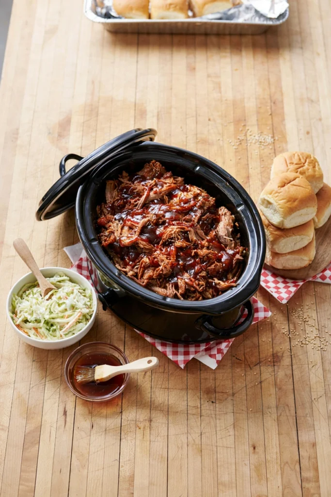 Slow cooker BBQ pulled pork with a slider bun and coleslaw