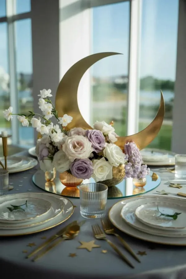 Over the moon baby shower decor with clouds, moons, and stars backdrop