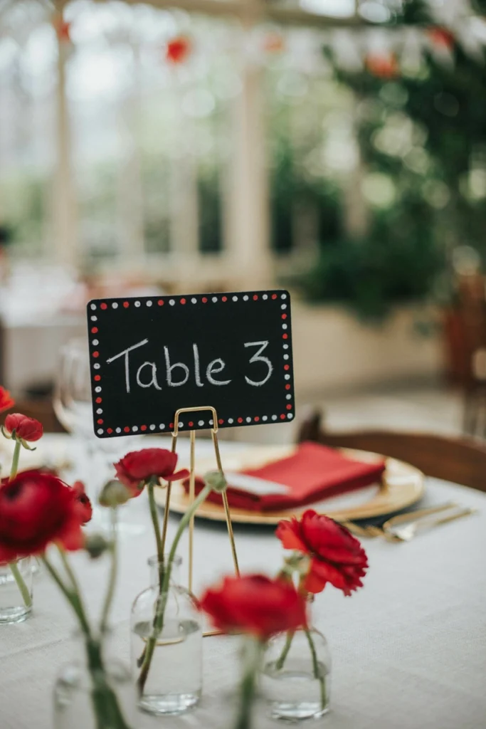 Mini chalkboard table number signs bordered with painted black dots