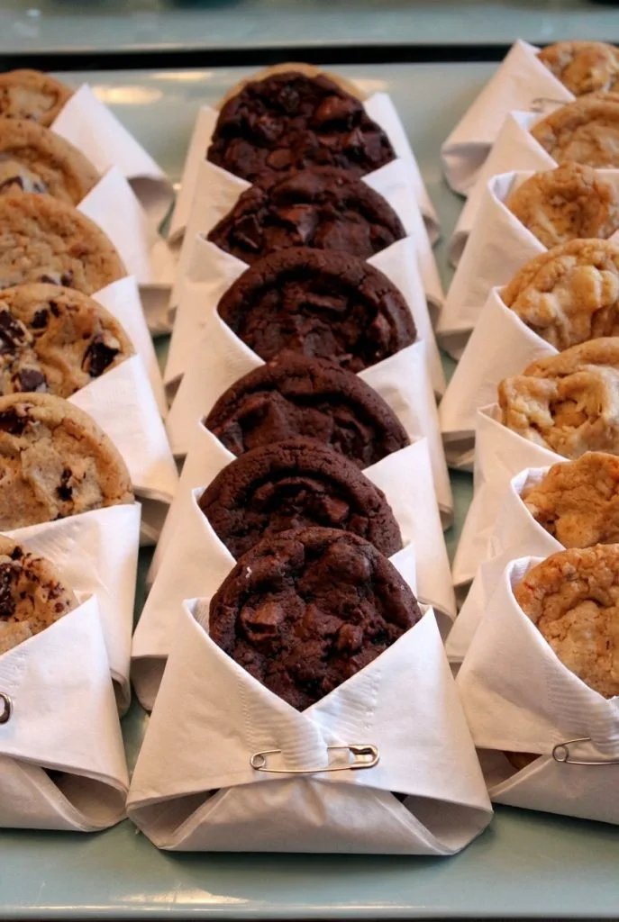 Individually wrapped grab and go cookies near a coffee bar