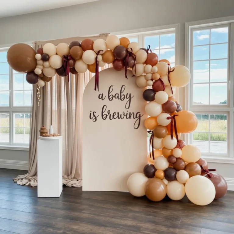 Statement balloon backdrop photo spot for a Baby Is Brewing baby shower