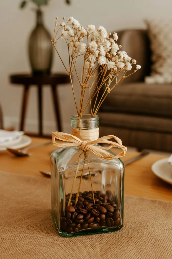 Rustic coffee bean centerpiece with dried florals and twine