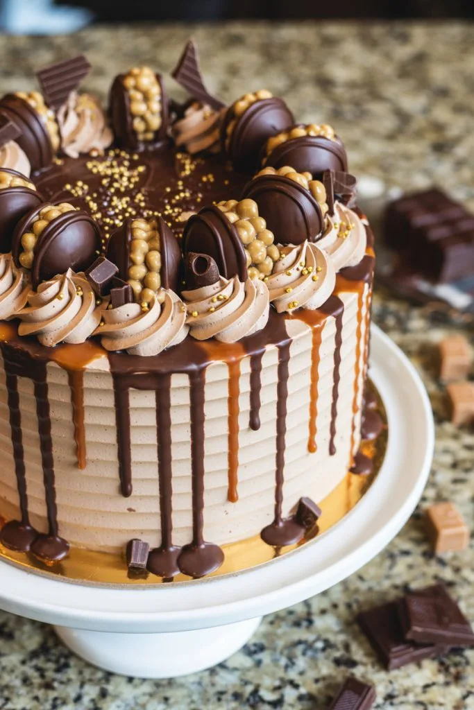 Mocha cake with chocolate drizzle and coffee themed cake topper