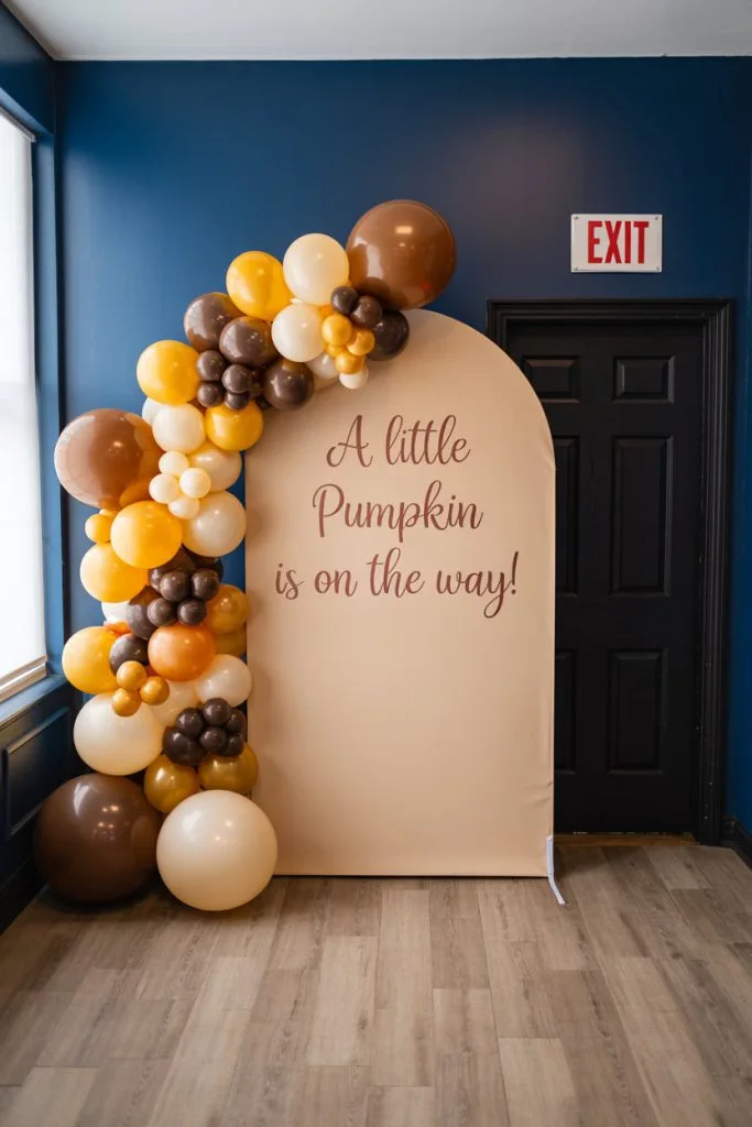 Mustard and chocolate balloon arch fall baby shower backdrop