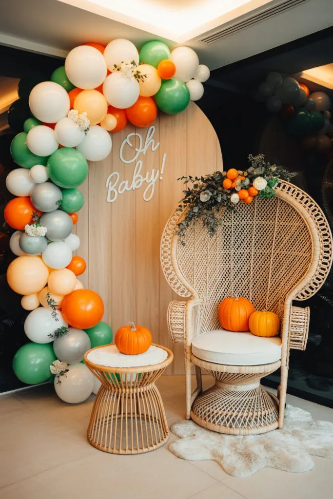 Peacock chair Oh Baby fall baby shower photo backdrop with pumpkins