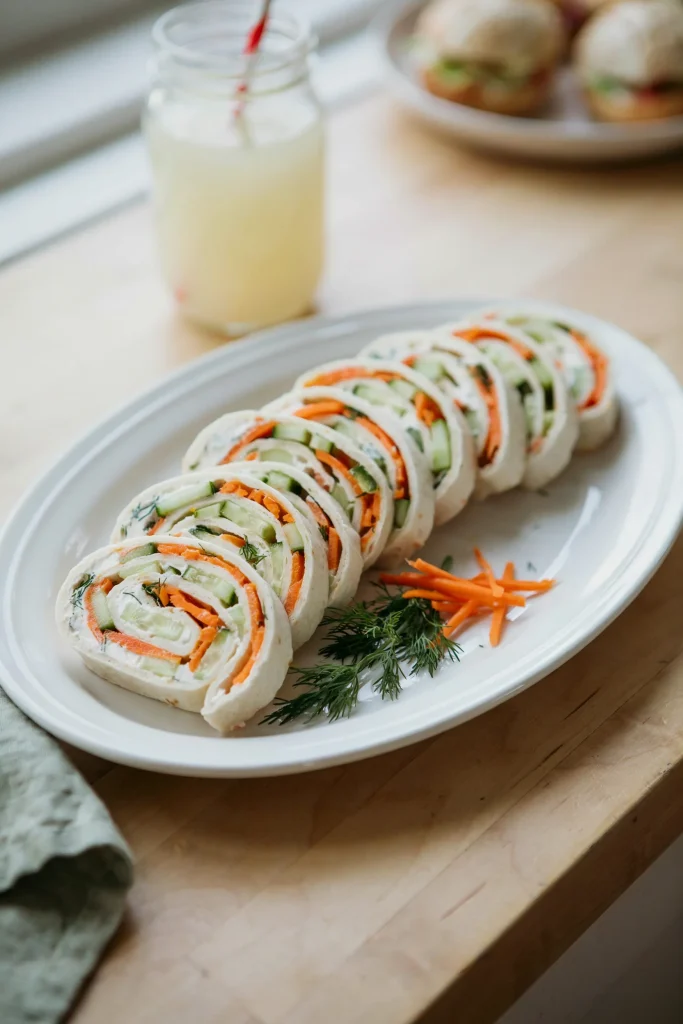Cucumber ranch pinwheel slices arranged on a platter