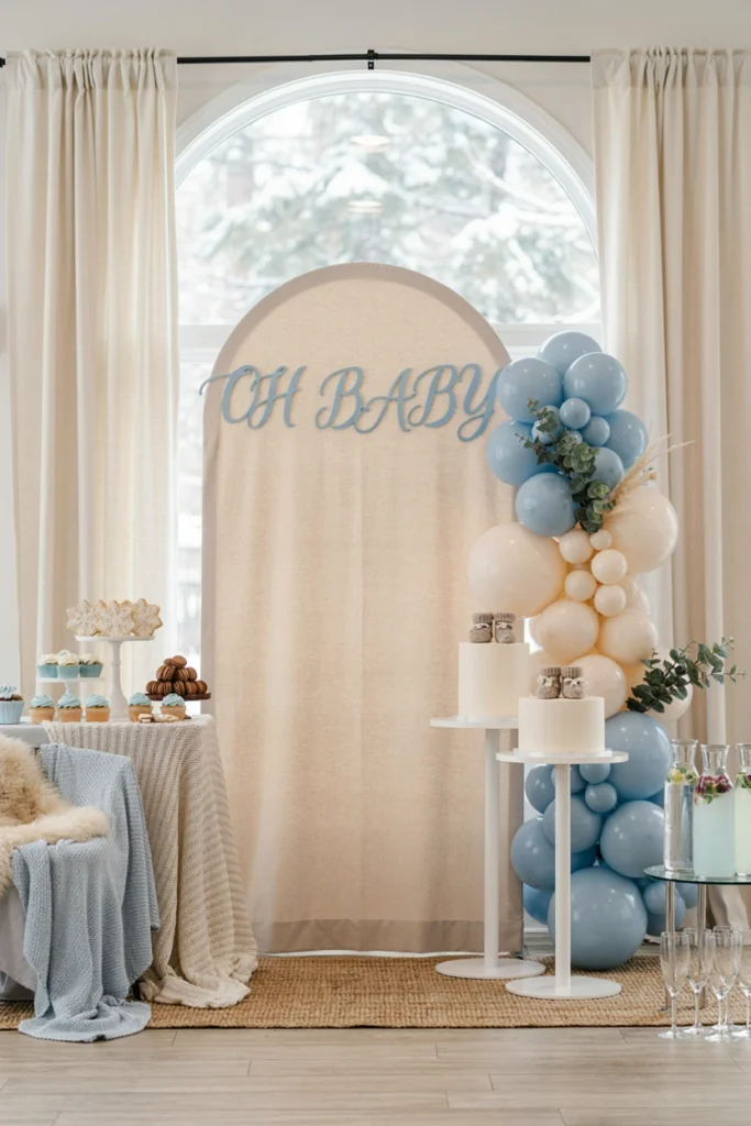 Faux fur throw layered under a plaid table runner with pinecones and eucalyptus for a Baby It's Cold Outside baby shower