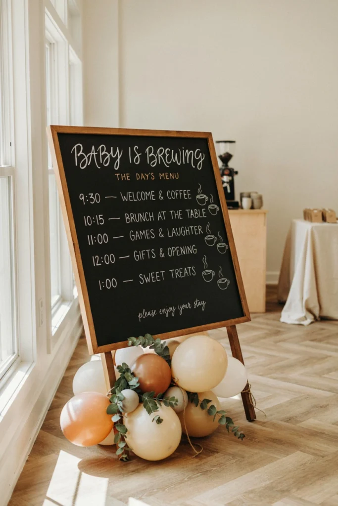 Chalkboard coffee shop menu displaying the baby shower schedule