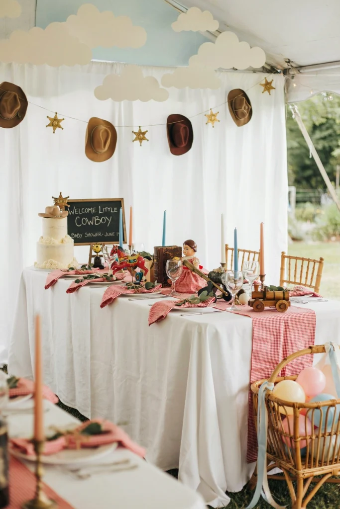Toy Story themed baby shower dessert table with red gingham and cloud backdrop