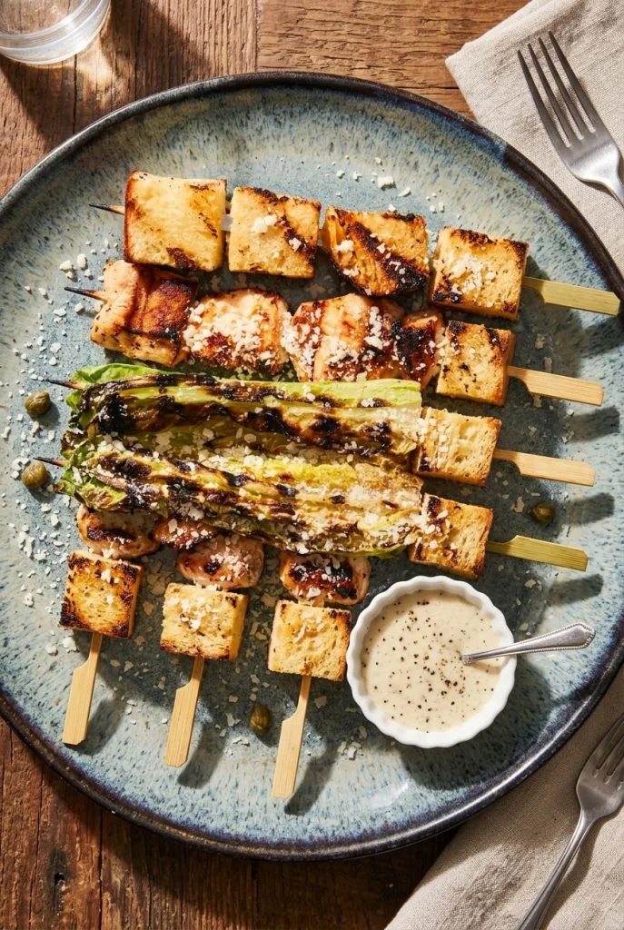 Chicken Caesar salad skewers with romaine, grilled chicken, parmesan, and croutons