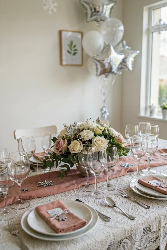 A baby shower table setting featuring blush pink linens, ivory flowers (baby's breath and roses), fresh sage greenery, and white place settings. Soft, diffused daylight. Clean, understated elegance
