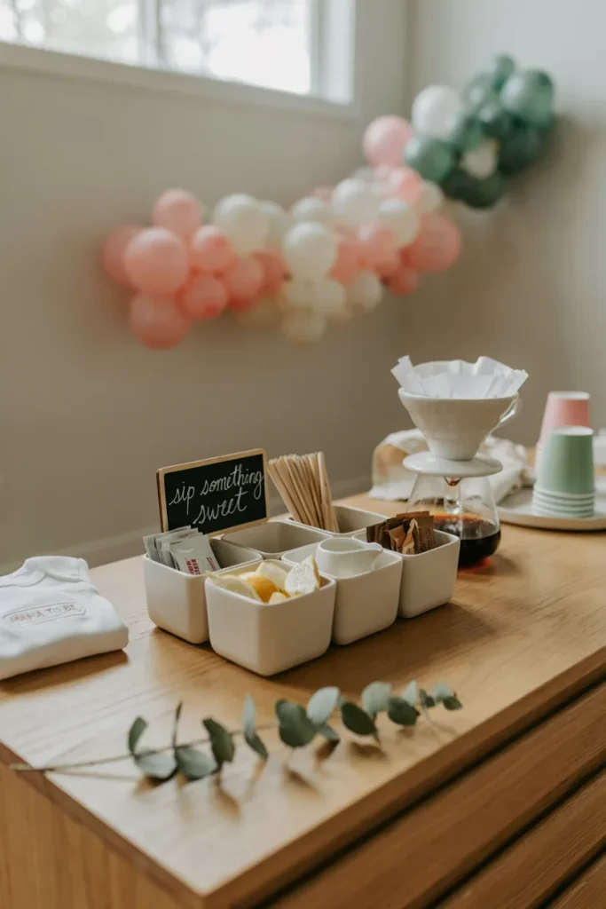 baby shower drink station A compact countertop caddy with six compartments holding sugar packets, stir sticks, lemon wedges, and creamer cups next to a coffee setup