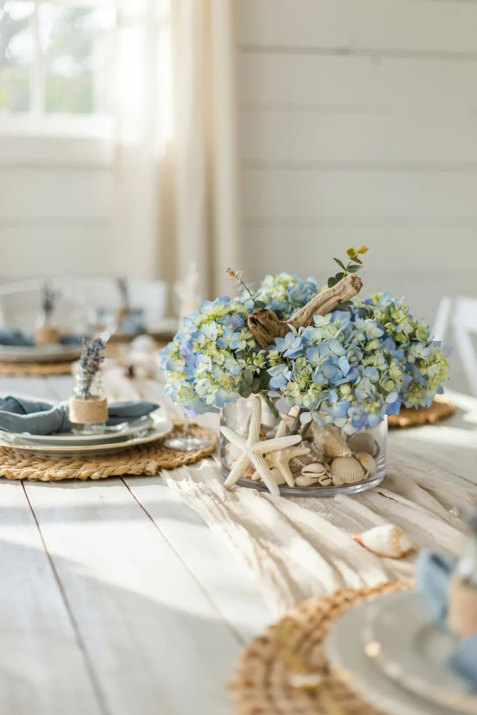 Coastal blue hydrangea and seashell baby shower centerpiece