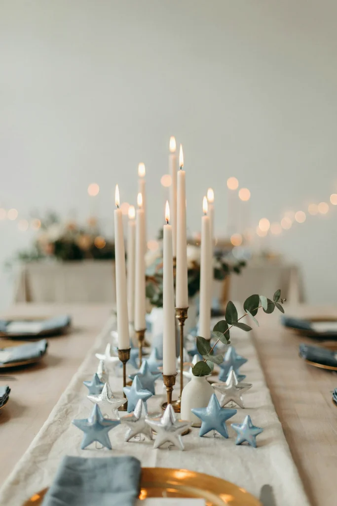 Silver and blue metallic star centerpieces on a baby shower table