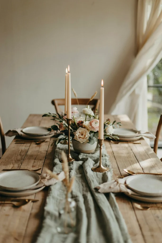 Sage green cheesecloth table runner on a baby shower table