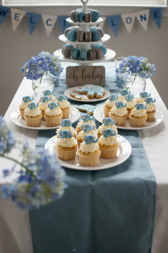 Blue elephant cupcake toppers on frosted cupcakes