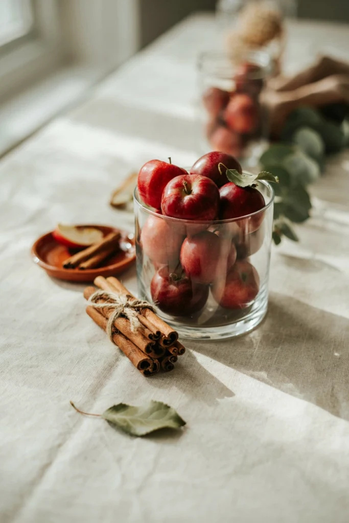 Apple and cinnamon stick jar centerpiece for a fall baby shower