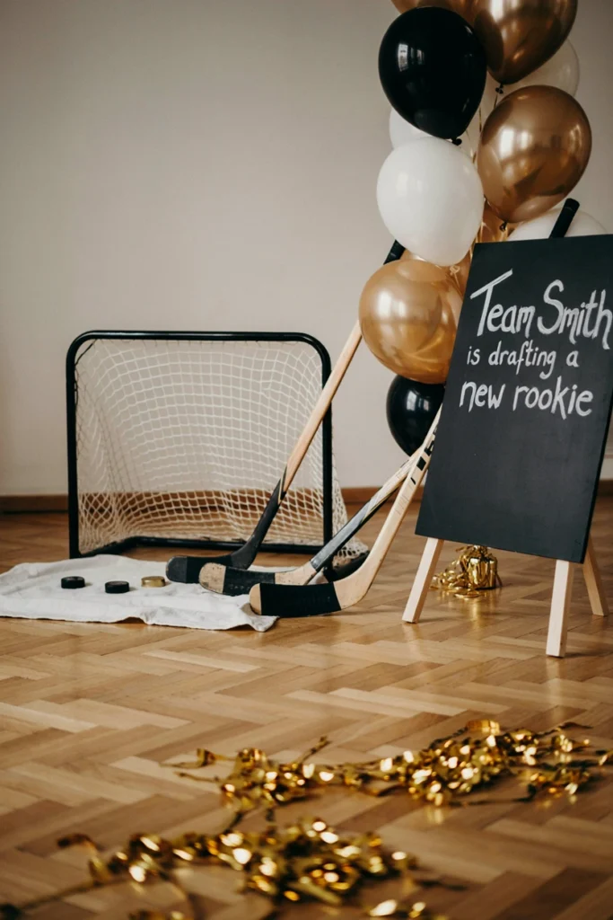 Mini shoot-the-puck game station set up for a hockey baby shower
