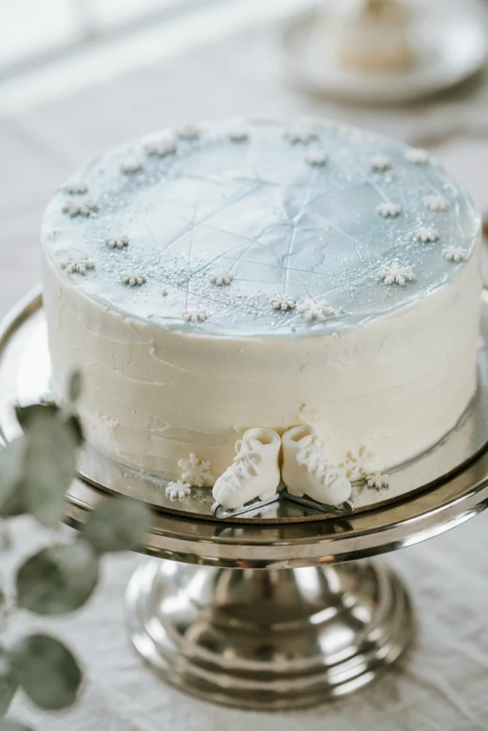 Frozen pond mirror glaze cake with fondant ice skates for a baby shower