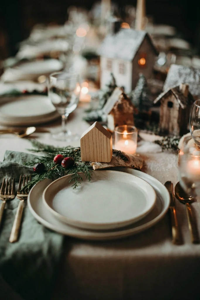 Birch bark place cards shaped like tiny village houses for a baby shower table setting