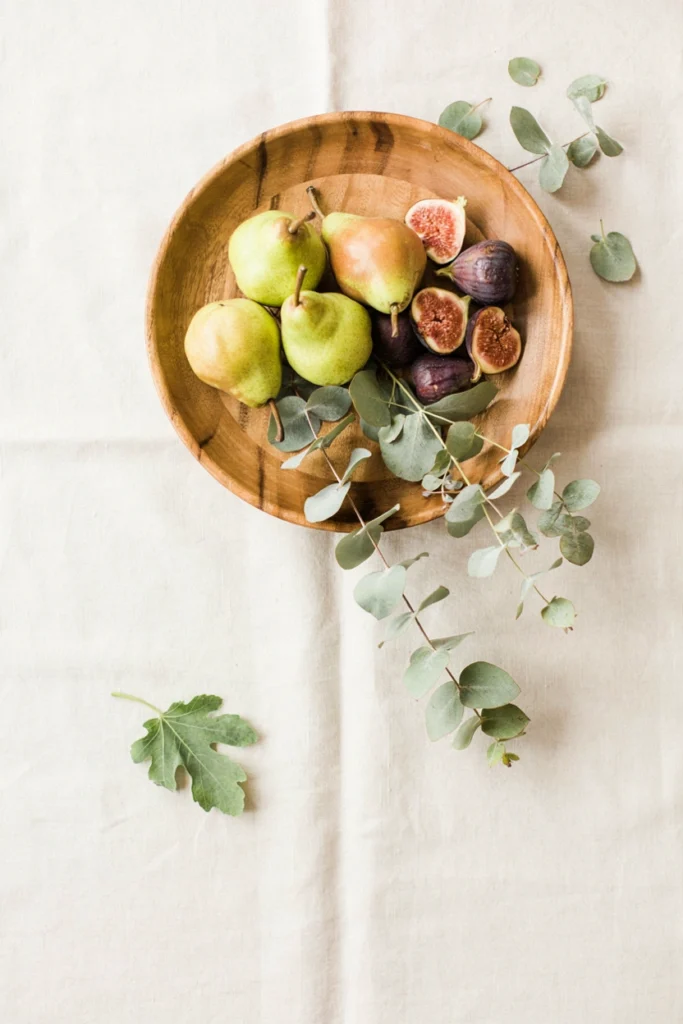 Pear and fig botanical centerpiece display for a non-pumpkin fall baby shower