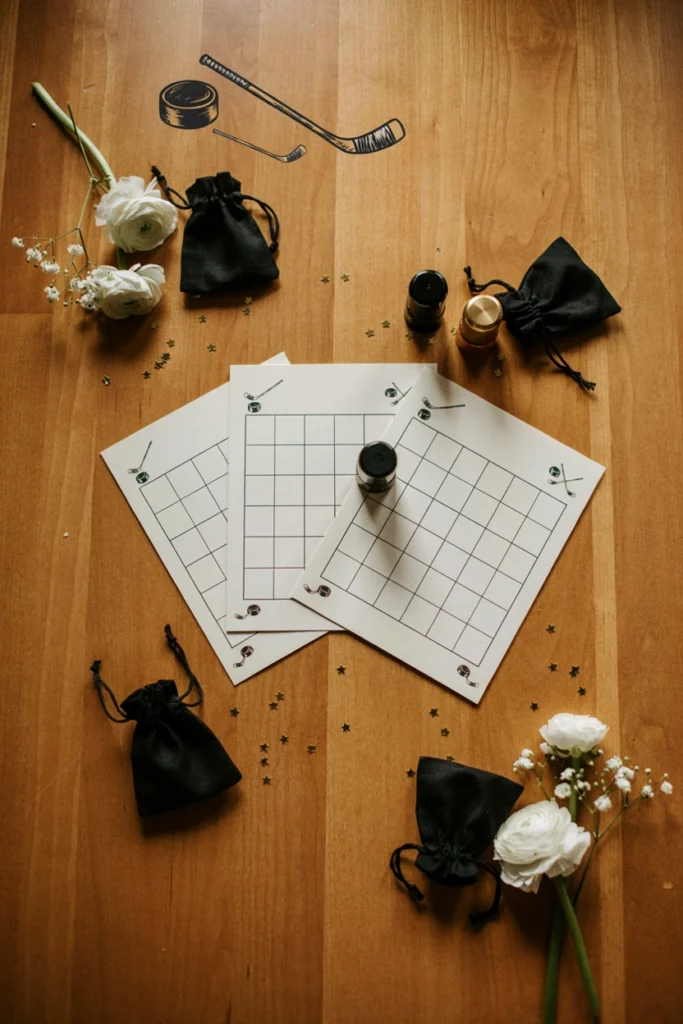Hockey trivia bingo cards set up for a hockey baby shower game