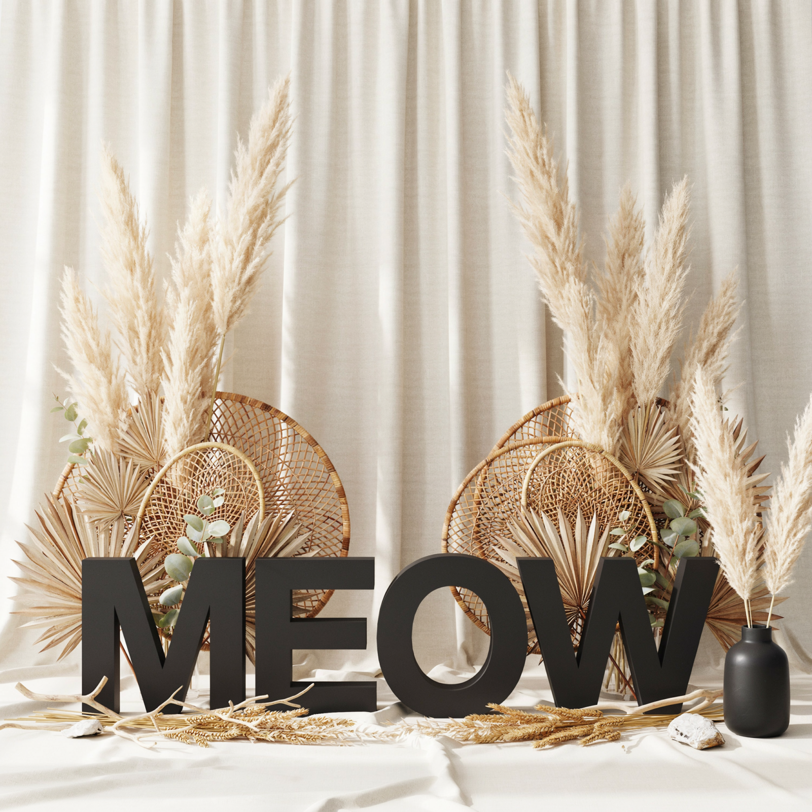 Black and white boho cat party backdrop with rattan fans and pampas grass
