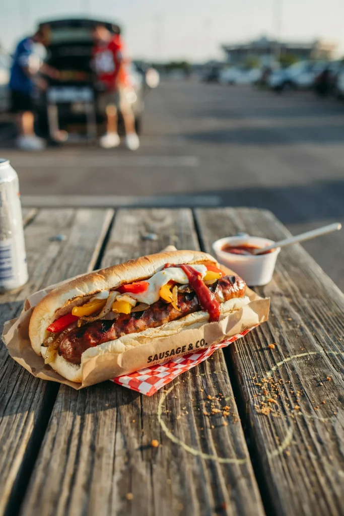Grilled Italian sausage hoagie with caramelized peppers and onions
