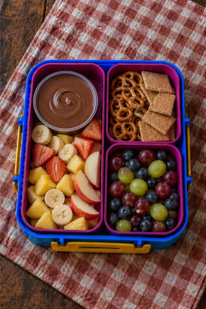 Fruit chunks with a chocolate dip cup