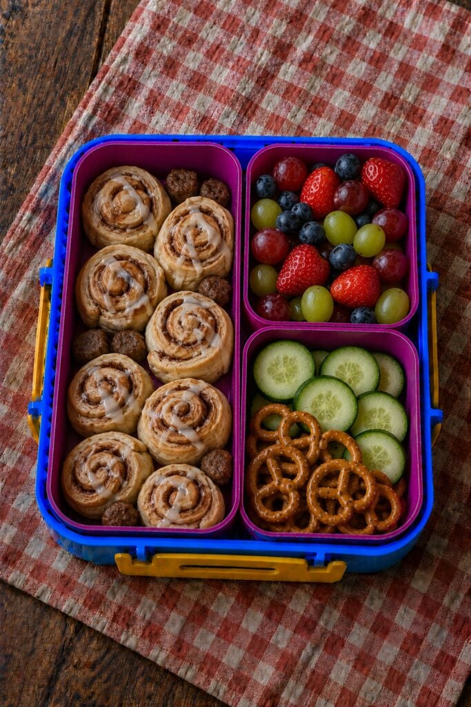 Small baked cinnamon roll bites with icing drizzle