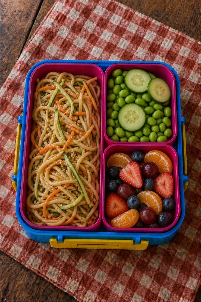 Noodles glossy with sesame sauce and scallions
