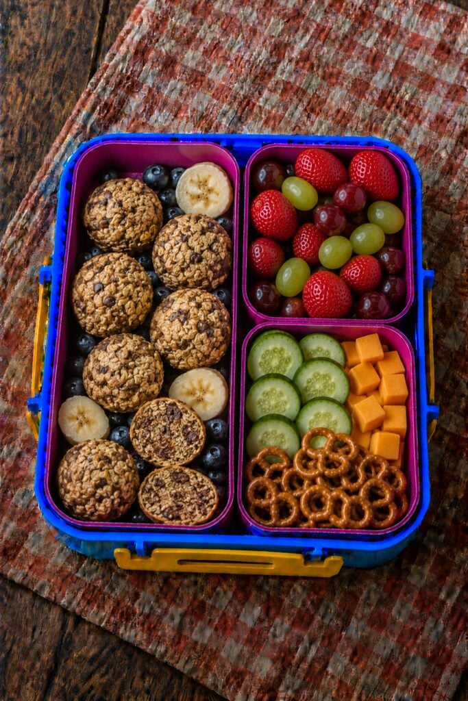 Rolled oat energy balls stacked in a box