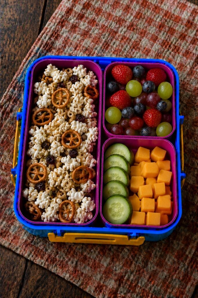 Popcorn mixed with pretzels and raisins
