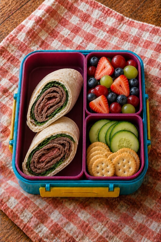 Roast beef wrap sliced to show the layers