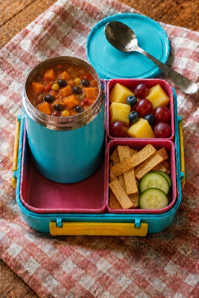 Orange sweet potato soup with black beans in a thermos