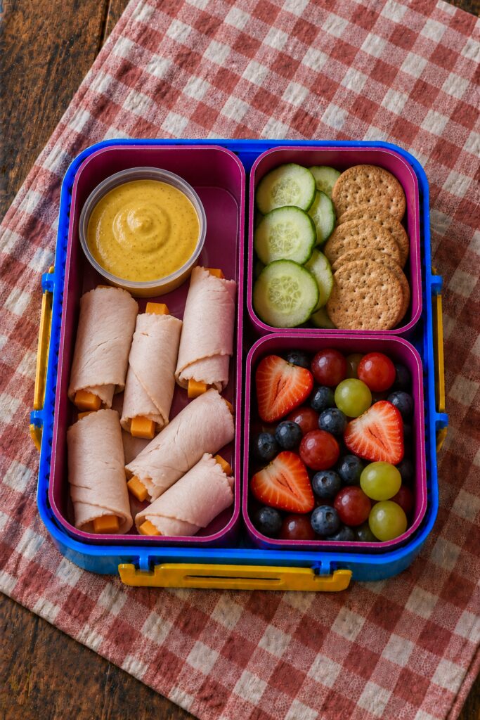 Rolled turkey slices with a honey mustard dip cup