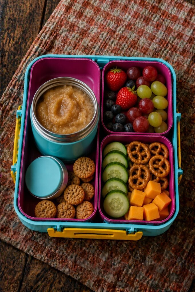 Applesauce in a thermos jar dusted with cinnamon