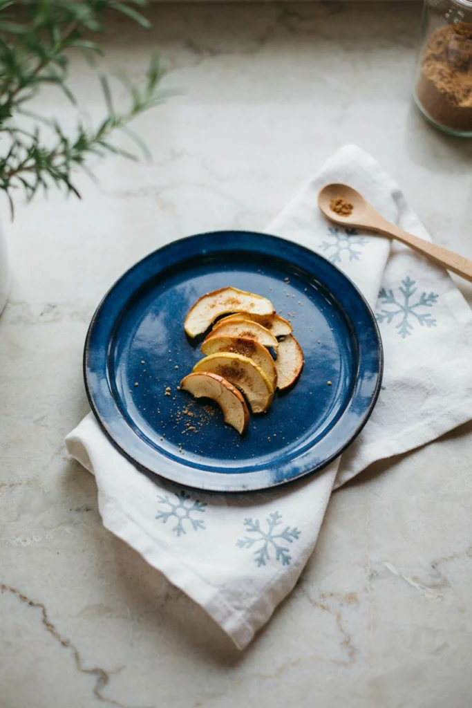 Thin crisp cinnamon apple chips arranged on a wire rack