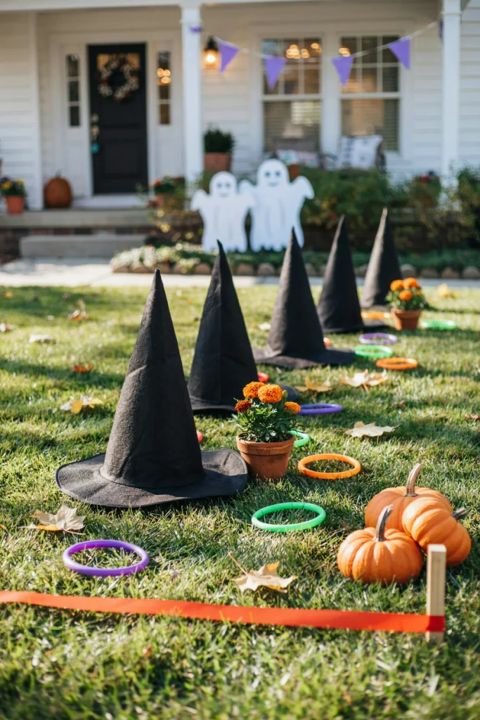 Kids tossing glow rings onto upright witch hats in a witch hat ring toss game at a kids Halloween party